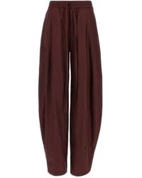ANDAMANE - Pleated Tapered Trousers - Lyst