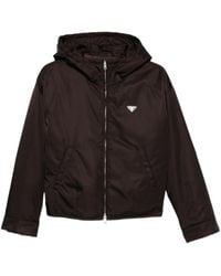Prada - Chaqueta con capucha y placa del logo - Lyst