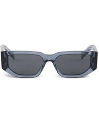 Prada - Gafas de sol con logo triangular - Lyst