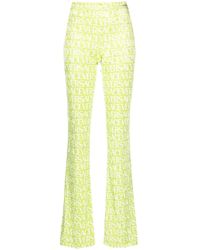 Versace - Logo-print Flared Trousers - Lyst