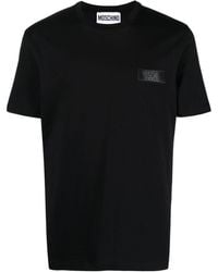 Moschino - T-shirt con applicazione logo - Lyst