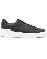 Balmain - Logo-Embossed Lace-Up Sneakers - Lyst