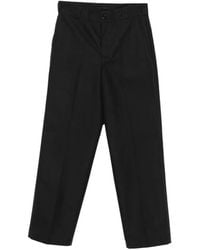 Prada - Pressed-Crease Logo-Plaque Trousers - Lyst