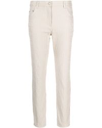 Moschino - Logo-print Cotton-blend Tapered Trousers - Lyst