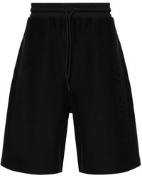Moncler - Pantalones cortos de chándal con logo en relieve - Lyst