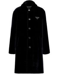 Prada - Manteau en peau lainée à patch logo - Lyst
