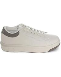 ARMANI EXCHANGE - Logo-Embossed Low-Top Sneakers - Lyst