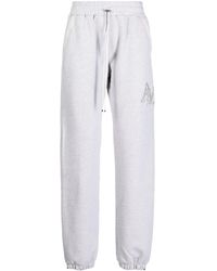 Amiri - Staggered Logo-embroidered Track Pants - Lyst