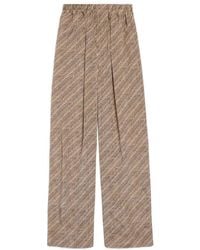 Balenciaga - All-Over Logo-Print Silk Trousers - Lyst