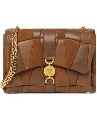 Versace - Gesteppte Kleio Schultertasche - Lyst