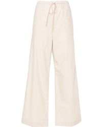 Totême - Straight-leg Drawstring Cotton Trousers - Lyst