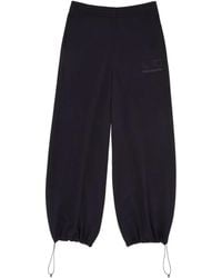MM6 MAISON MARGIELA X SALOMON - Drawstring-Cuff Logo-Print Trousers - Lyst