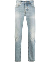 Saint Laurent - Slim-Fit-Jeans mit Logo-Schild - Lyst