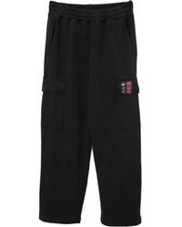 Izzue - Logo-Patch Trousers - Lyst