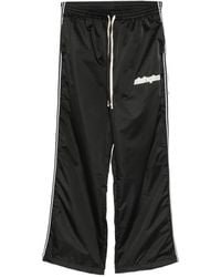 RIVINGTON roi Rebis - Logo-Print Side-Stripe Track Pants - Lyst