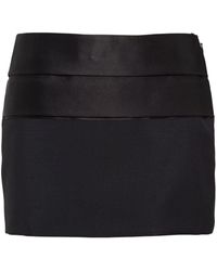 Prada - Minifalda a paneles con logo triangular - Lyst