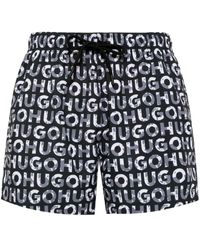 HUGO - Shorts mit durchgehendem Logo-Print - Lyst