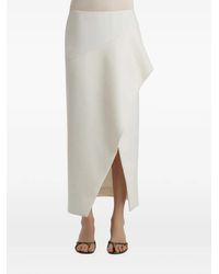 KHAITE - Jaia Ruffled Split Midi Skirt - Lyst