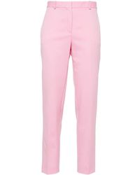 Versace - Pantalones ajustados con pinzas - Lyst