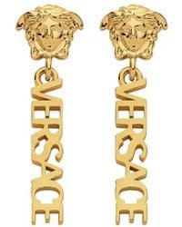 Versace - Orecchini Pendenti Logati - Lyst