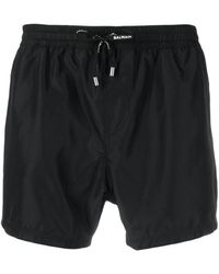Balmain - Pantalones cortos de chándal con franjas del logo - Lyst
