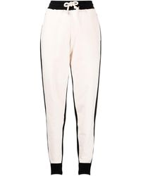 JW Anderson - Pantalones de chándal ajustados con diseño colour block - Lyst
