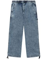 Izzue - Lockere Jeans mit Logo-Applikation - Lyst