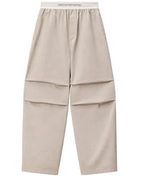Alexander Wang - Logo-Waistband Pleated Trousers - Lyst