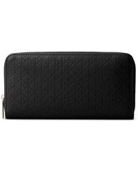 Calvin Klein - Perforated-Monogram Zip-Around Wallet - Lyst