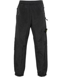 Stone Island - 32519 Compass-motif Trousers - Lyst
