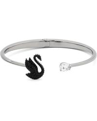 Swarovski - Swan Bangle Bracelet - Lyst