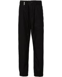Versace - Logo-strap Tapered-leg Trousers - Lyst