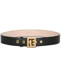 Balmain - Cintura nera con placca logo oro - Lyst