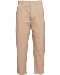 Prada - Pantaloni affusolati con placca logo - Lyst