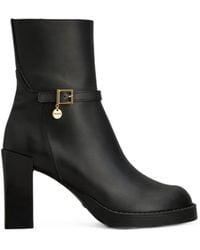 Tod's - Buckle-Strap Logo-Pendant Ankle Boots - Lyst