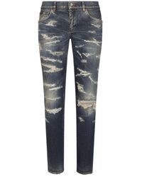 Dolce & Gabbana - Jeans skinny strappati con finitura consumata - Lyst