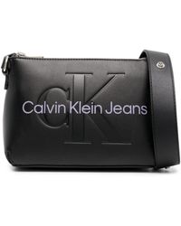 Calvin Klein - Embossed-logo Faux-leather Crossbody Bag - Lyst