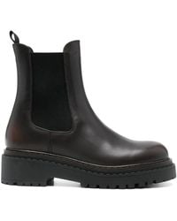 Prada - Debossed Logo Calf Leather Ankle Boots - Lyst