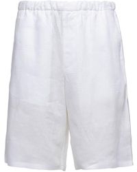 Prada - Shorts mit Logo-Patch - Lyst