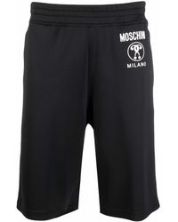 Moschino - Pantalones cortos de deporte con franjas del logo - Lyst