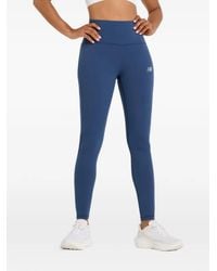 New Balance - Leggins con detalle del logo - Lyst