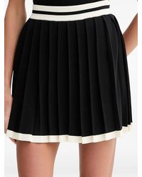 Guess - Logo-Waistband Pleated Mini Skirt - Lyst