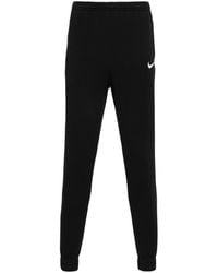 Nike - Pantalones de chándal con logo Swoosh - Lyst