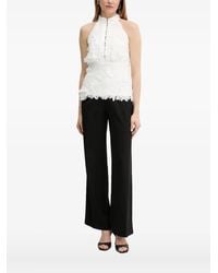 Bardot - Top con cuello halter y encaje floral - Lyst