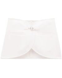 Courreges - Ellipse Buckled Curved Miniskirt - Lyst