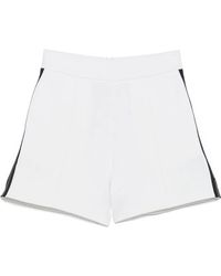 EA7 - Pantalones cortos de deporte con ribete de rayas - Lyst