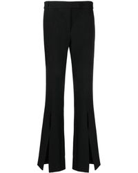 Versace - Logo-lettering Flared Trousers - Lyst