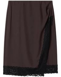 Stylein - Millicent Lace-Trim Wrap Mini Skirt - Lyst
