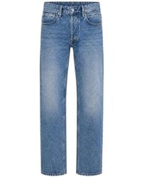 Replay - Faded-Effect Logo-Patch Jeans - Lyst