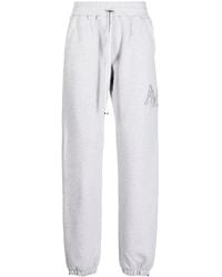Amiri - Staggered Logo-Embroidered Track Pants - Lyst
